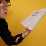 spanish tutor checking a book